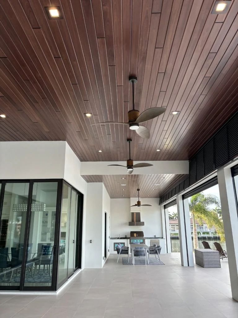 Red Grandis Bordeaux plank ceiling extending across a covered outdoor room