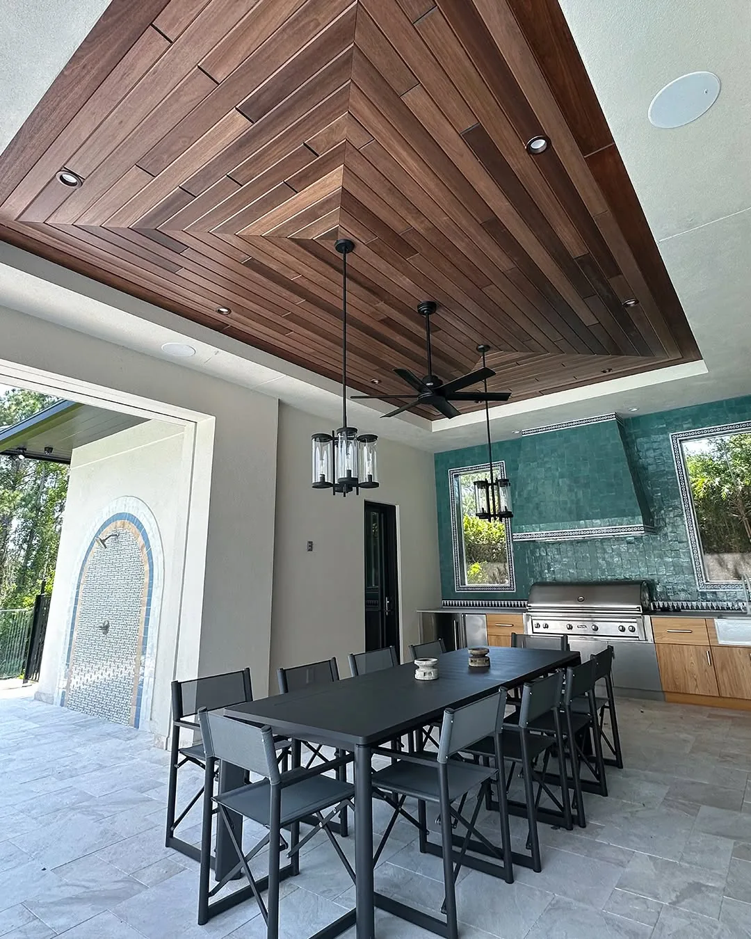 Red Grandis planks arranged in a geometric ceiling pattern above a covered outdoor kitchen